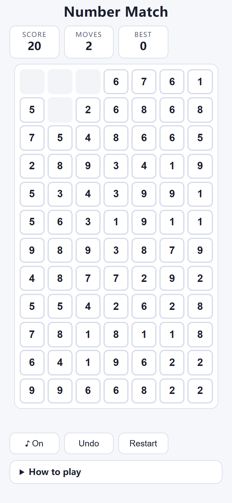 Number Match on a phone after two cleared pairs, with holes at the top of columns where gravity pulled numbers down