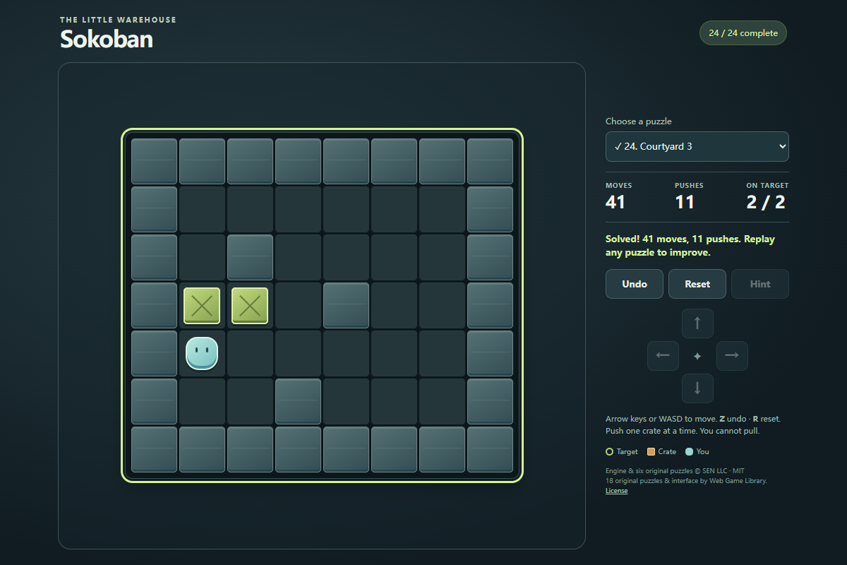 Sokoban final puzzle completed with two green crates on targets and the status Solved 41 moves 11 pushes
