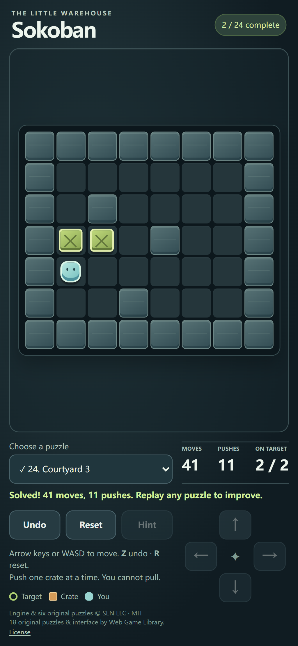 Sokoban portrait touch layout with the final puzzle solved and on-screen direction controls below the board